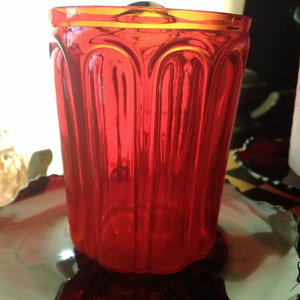 Vintage handmade tumbler in ruby bulging loops